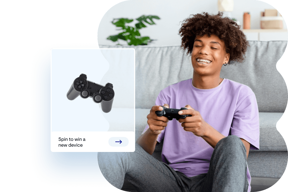 Teenager sitting on the floor playing a video game