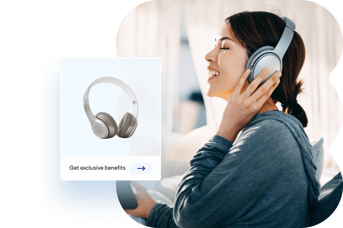 Woman smiling in headphones listening to music