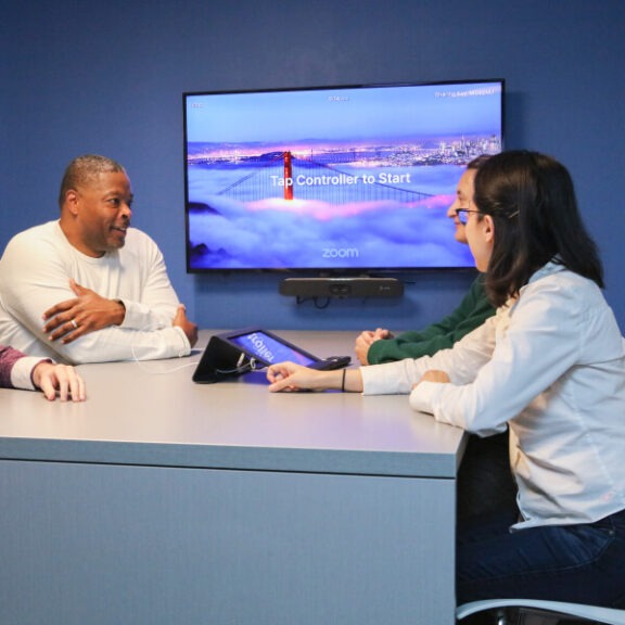 ebbo employees in a meeting